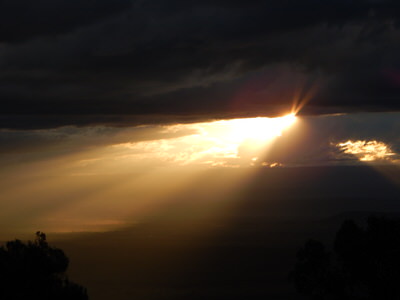 Light breaking through clouds over the Great Rift Valley escarpment, Naivasha Kenya