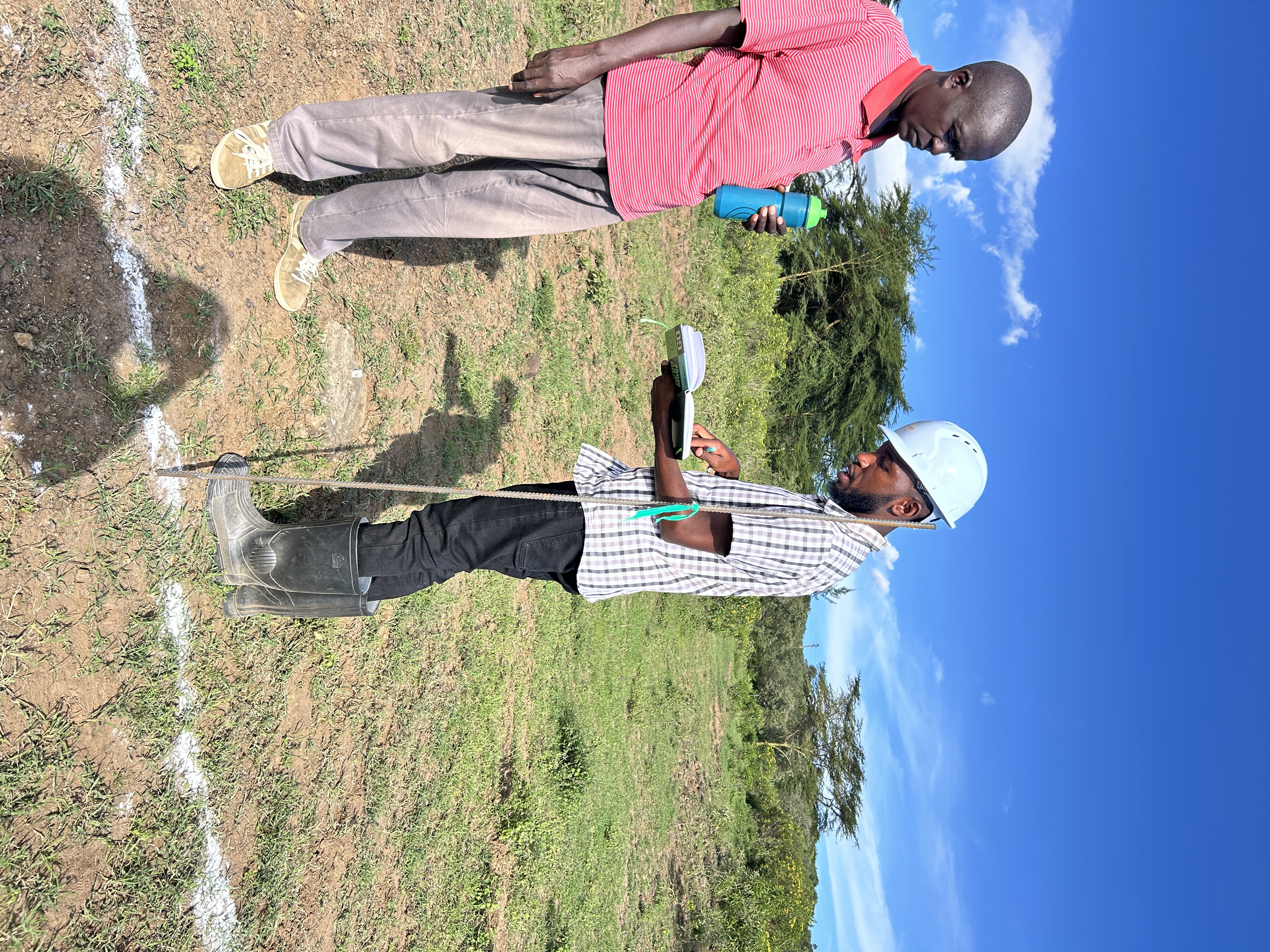 Sam the QS surveying the foundation at Lava & Lake, Naivasha